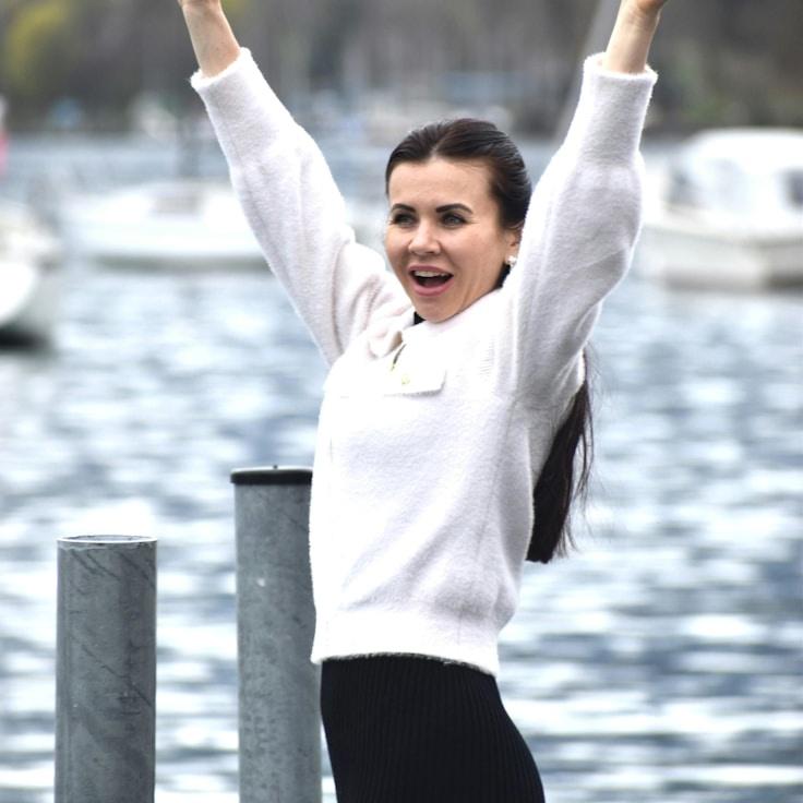 Alex Rivera, Lead Design Curator at MeadowMossLeaf, reviewing corporate floral arrangements